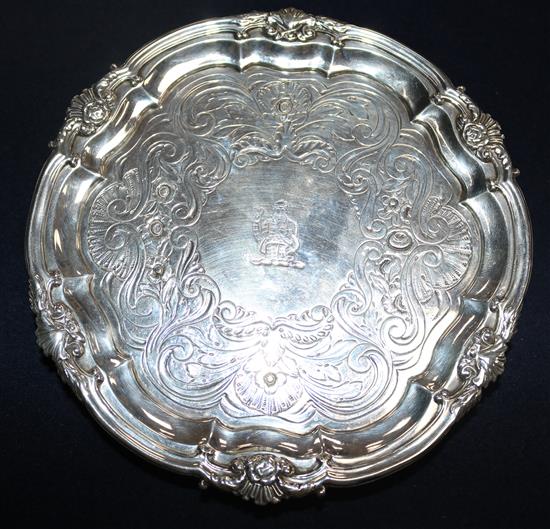 A George IV silver waiter, engraved and crested, with shell cast rim, WE, London 1825, 10 oz.